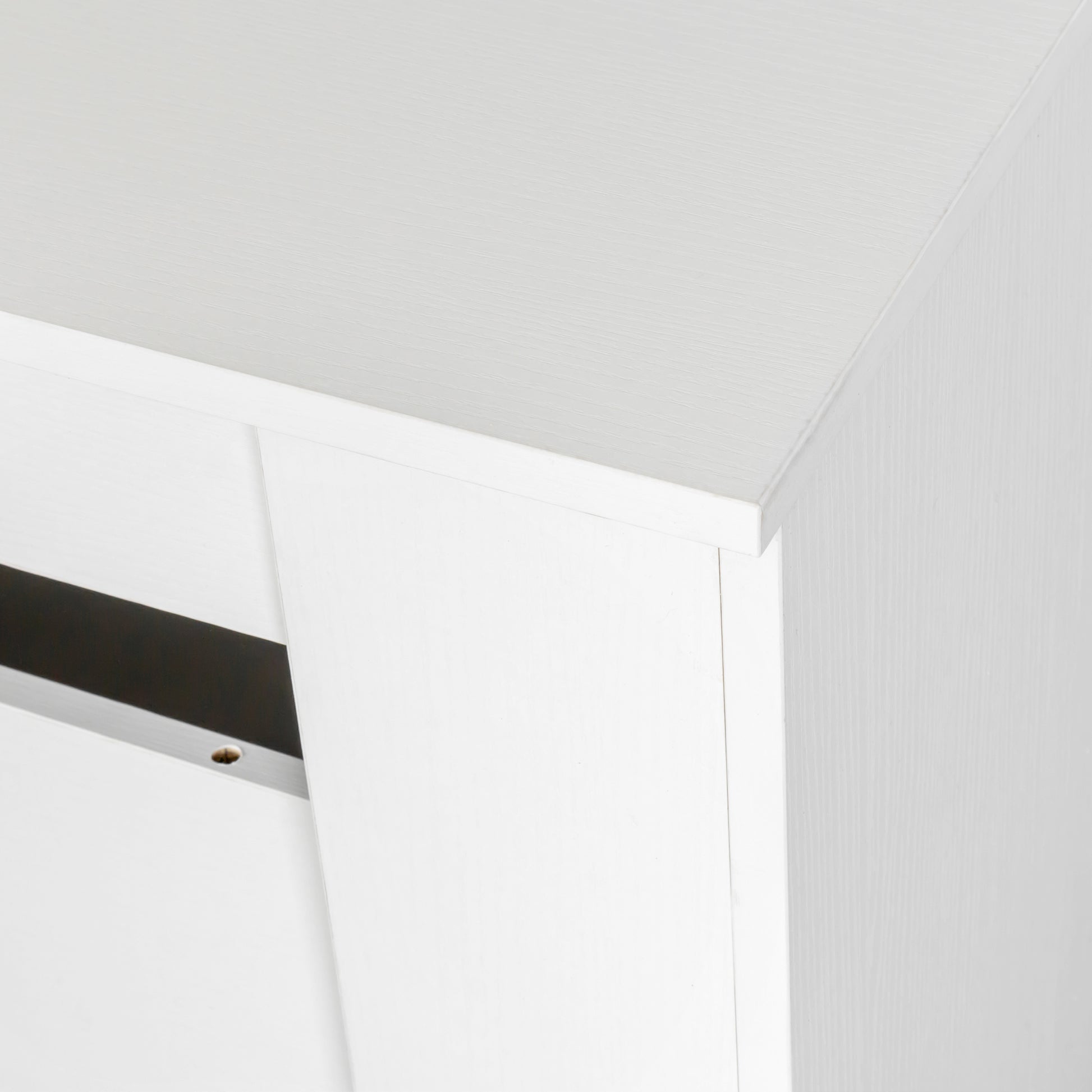 Closeup of white particle board edge with wood grain texture