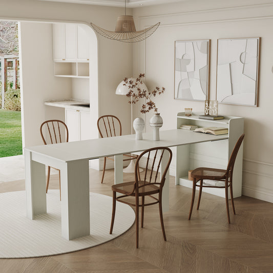 Expandable dining table with white finish and wooden chairs