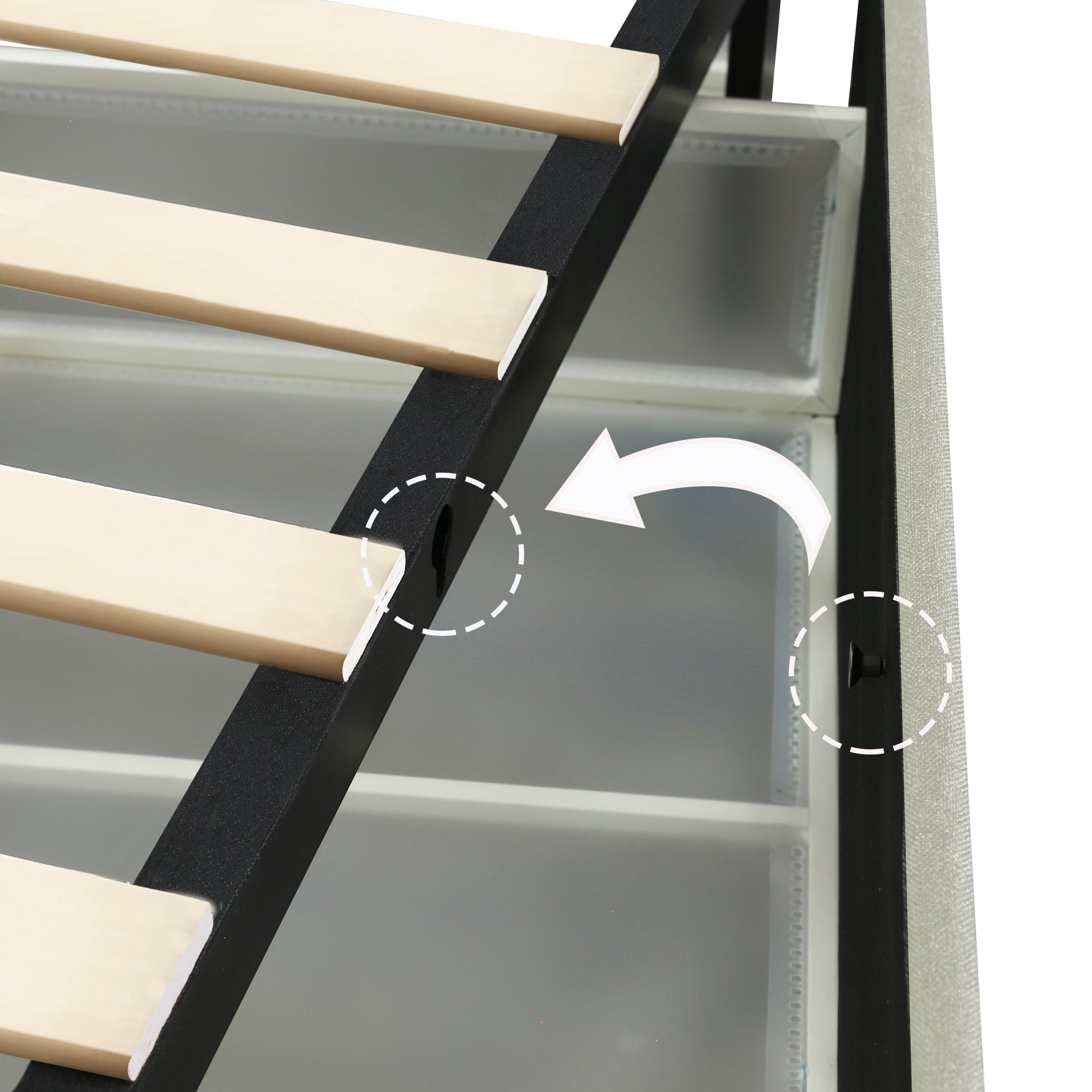 Closeup of metal bed frame with wooden slats and integrated storage drawers