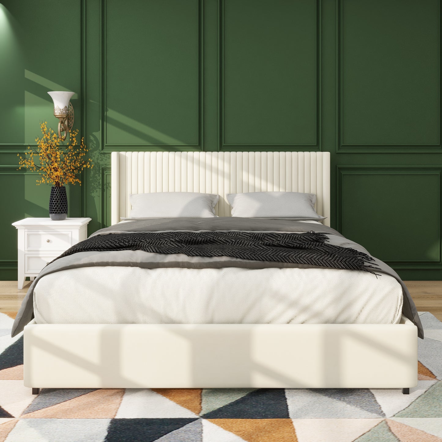 Cream upholstered platform bed with fluted headboard and dark patterned throw