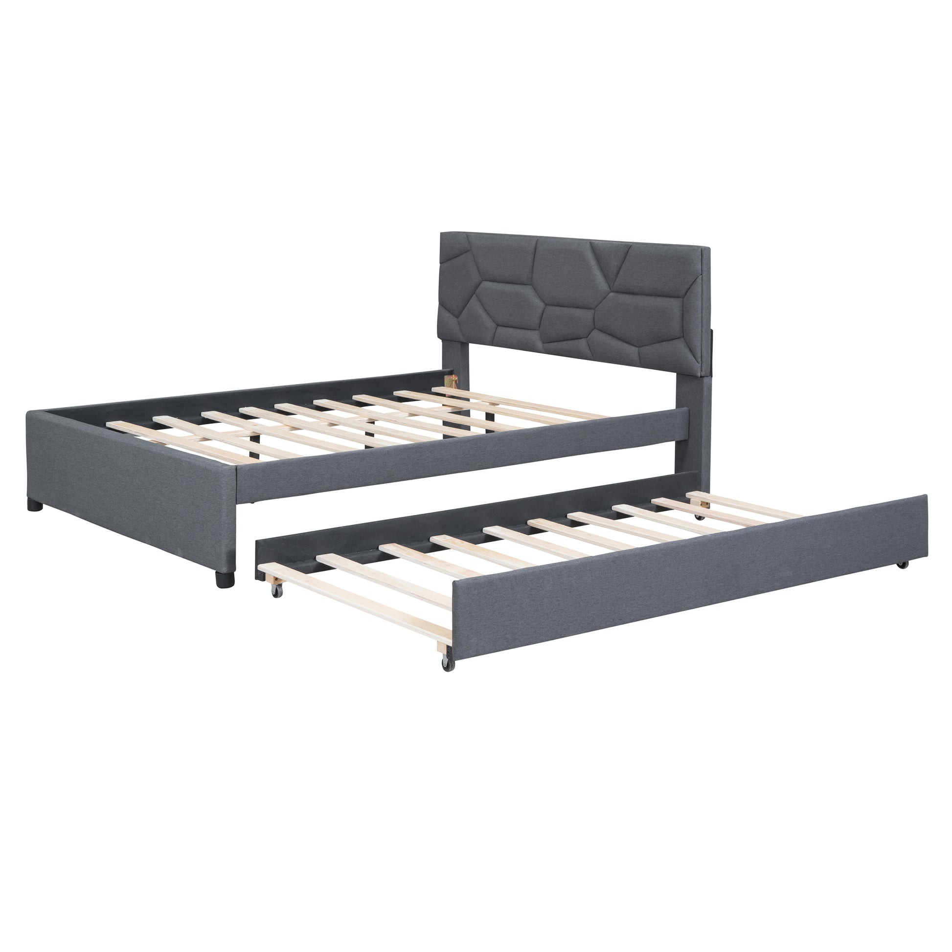 Gray upholstered twin daybed with pullout trundle bed and geometric headboard