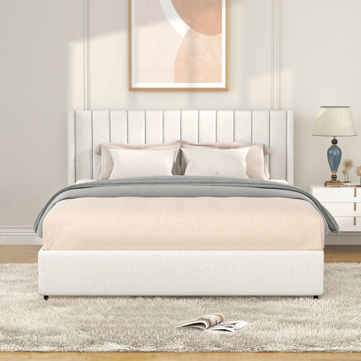 White upholstered platform bed with vertical channel tufting on the headboard