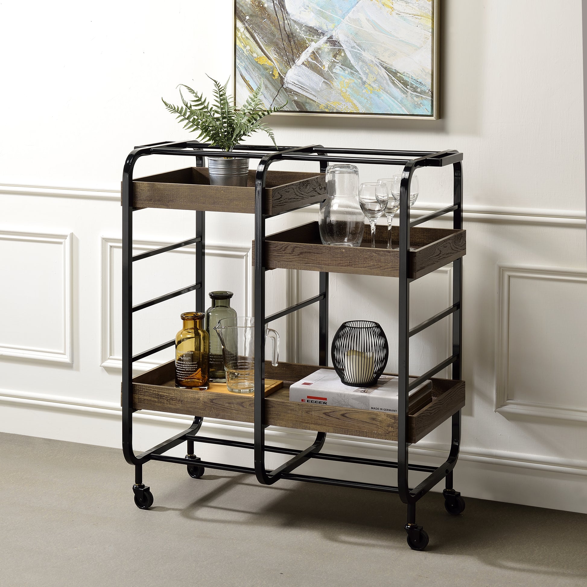 Industrial bar cart with black metal frame and three distressed wood shelves