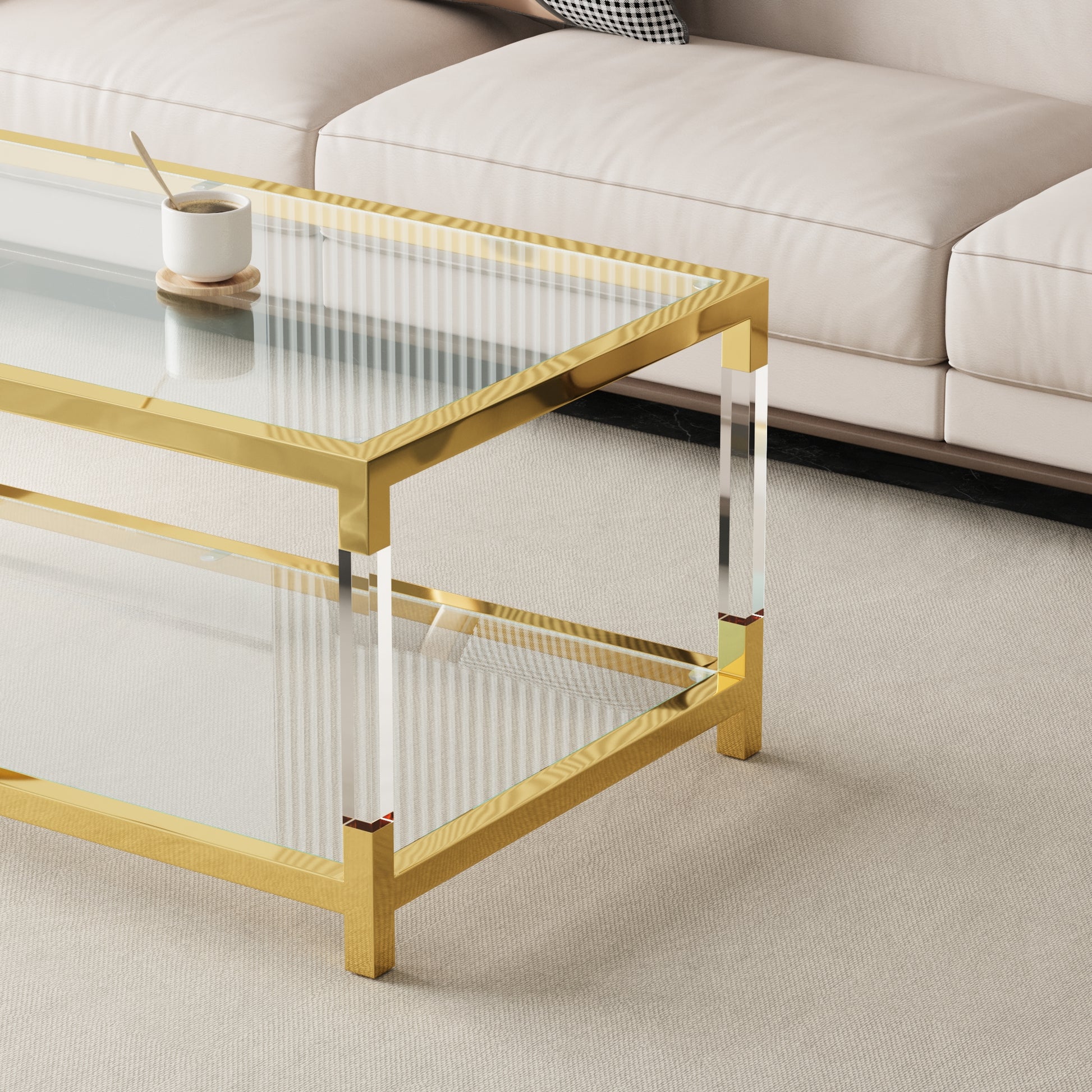 Modern gold and glass coffee table with acrylic legs