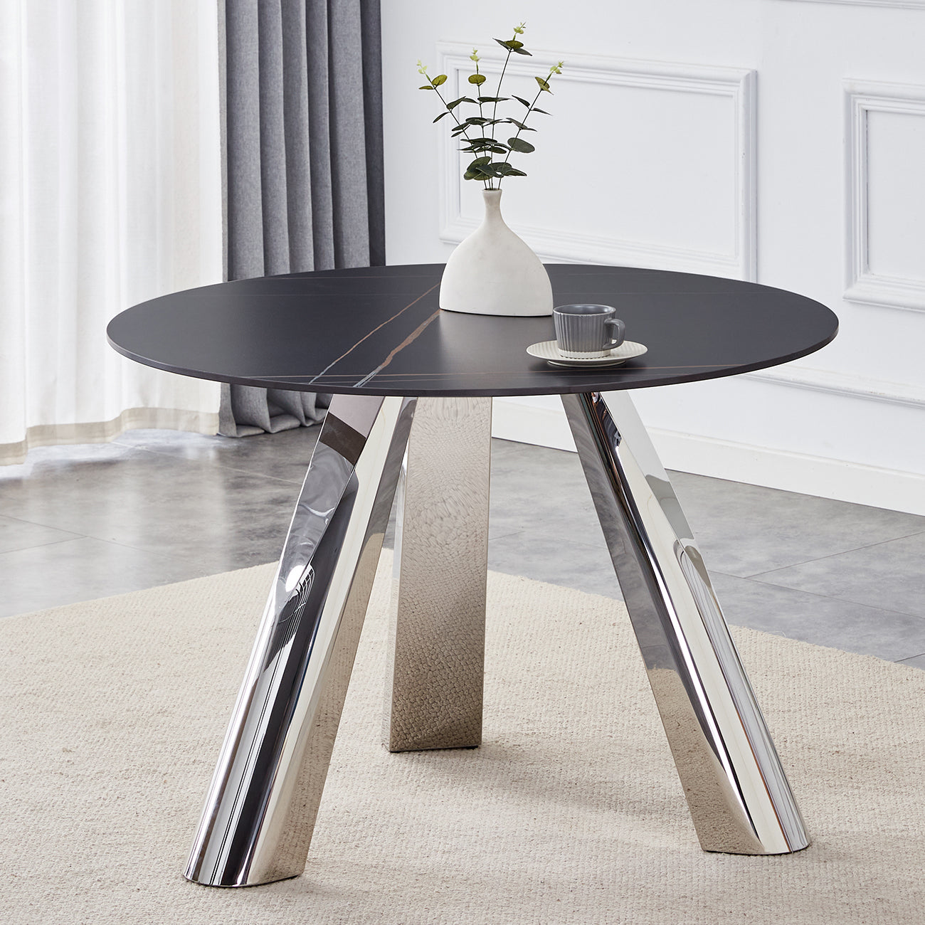Black marble round dining table with chrome legs
