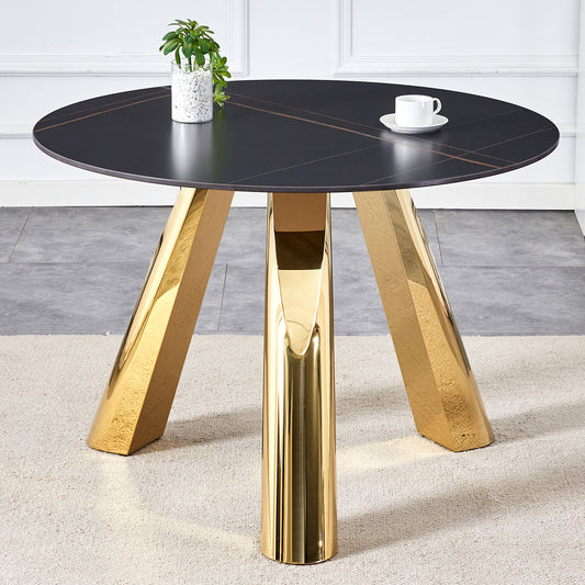 Round black marble dining table with striking gold legs