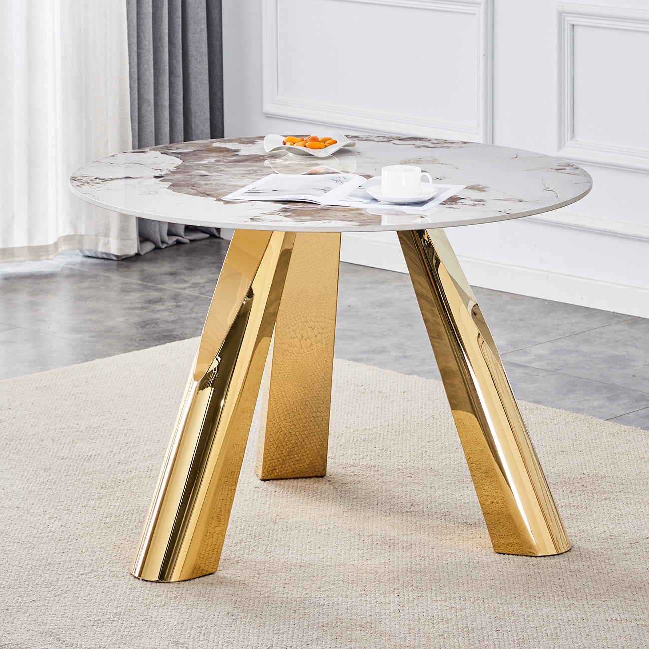Round marble dining table with polished gold base