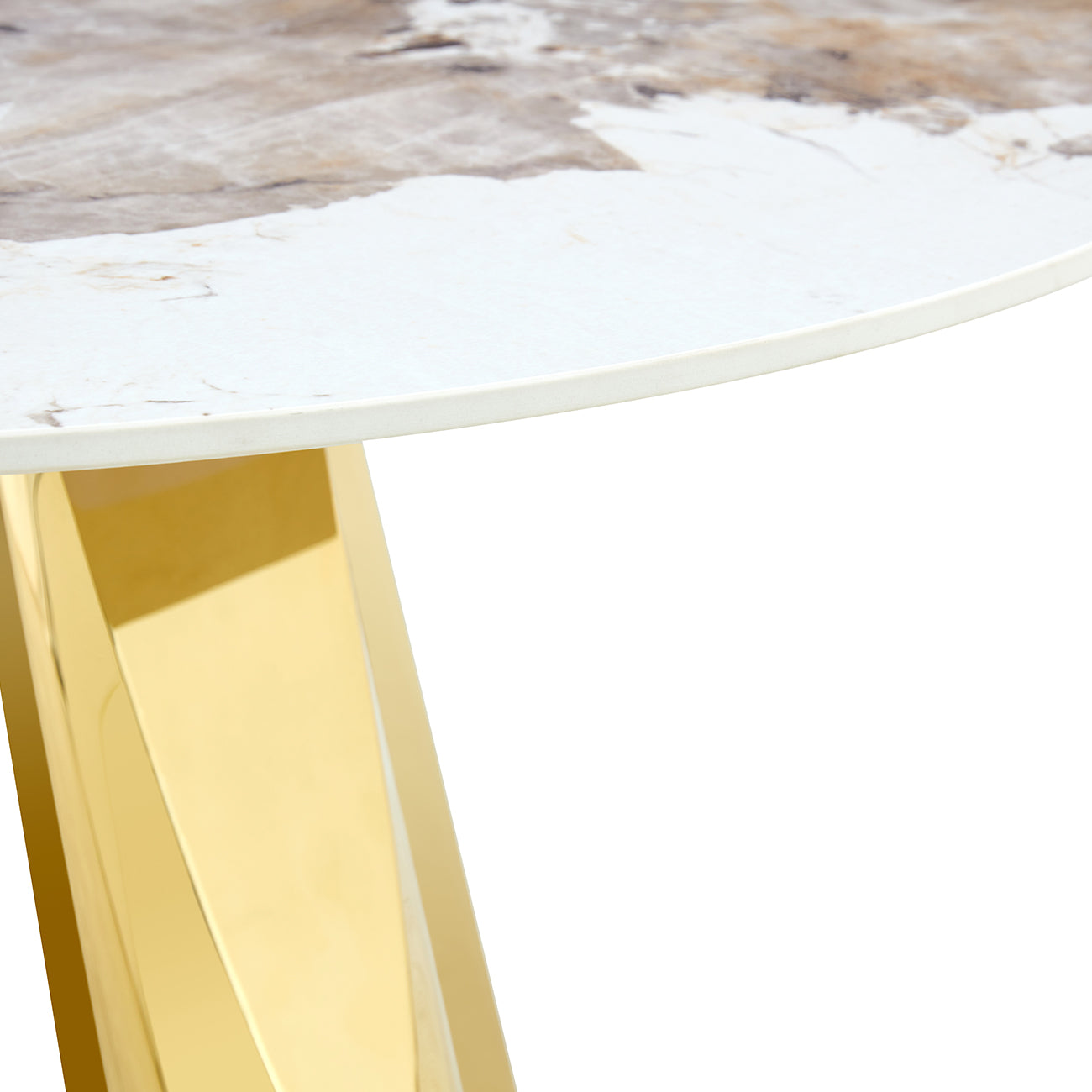 Closeup of a modern marblepatterned tabletop with a polished gold metal leg