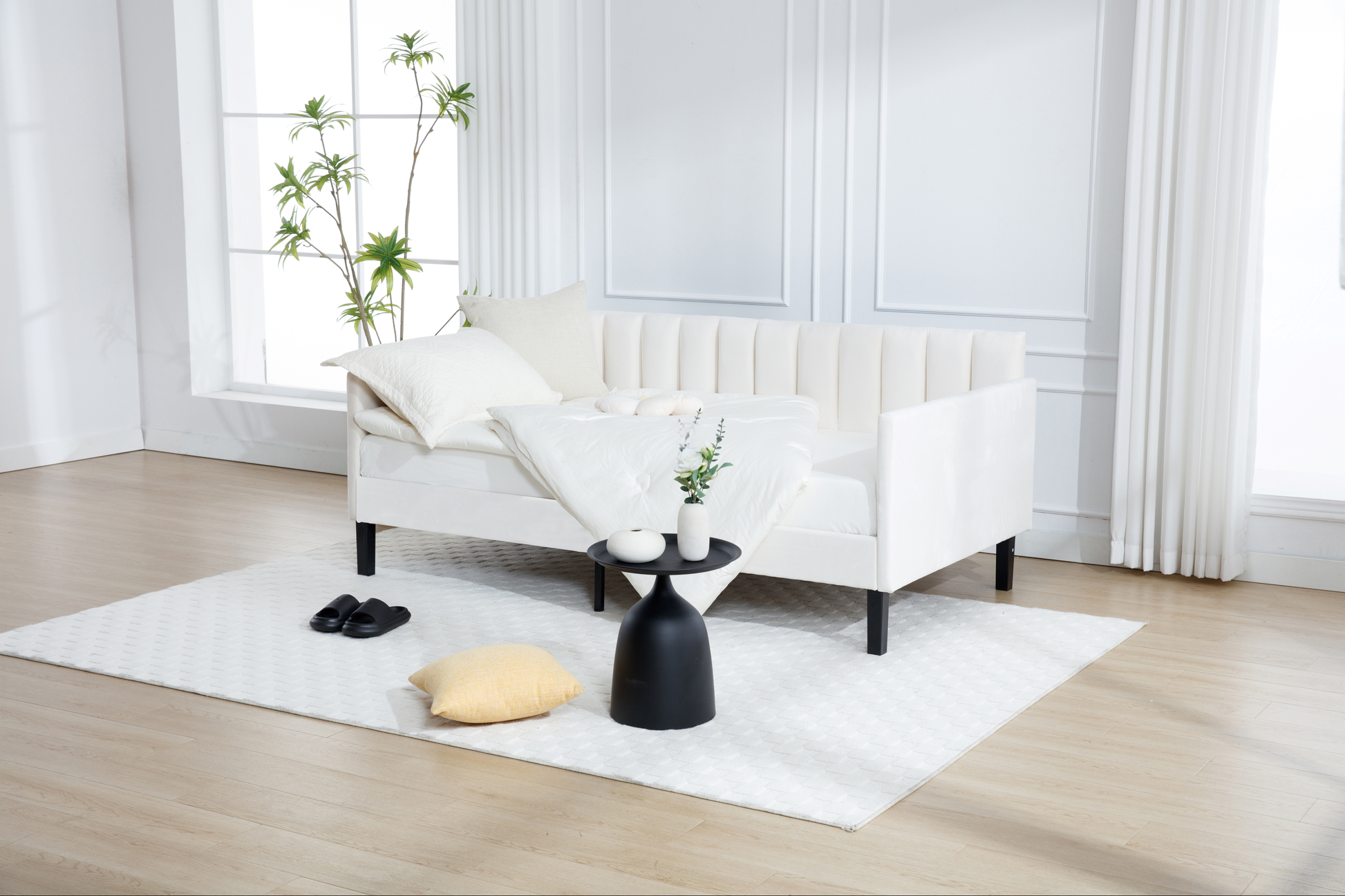 Modern white velvet couch with channel tufting and black legs