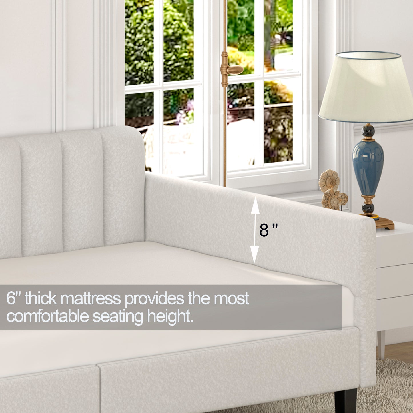 Cream upholstered daybed with channeled arms