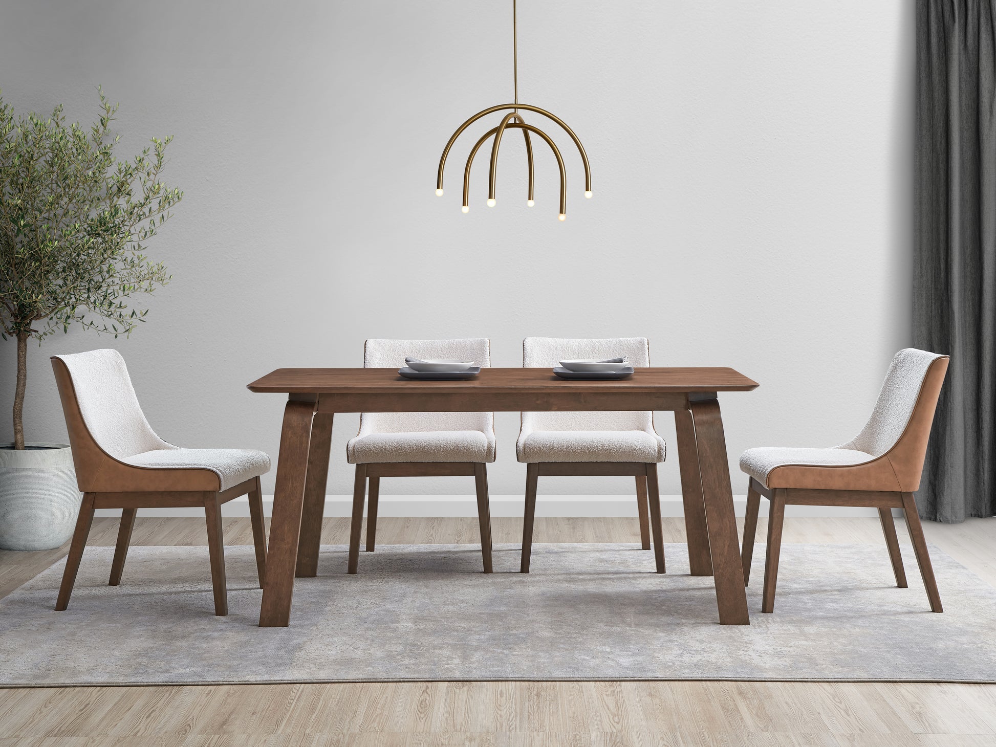 Dark walnut dining table with four textured cream and tan upholstered chairs