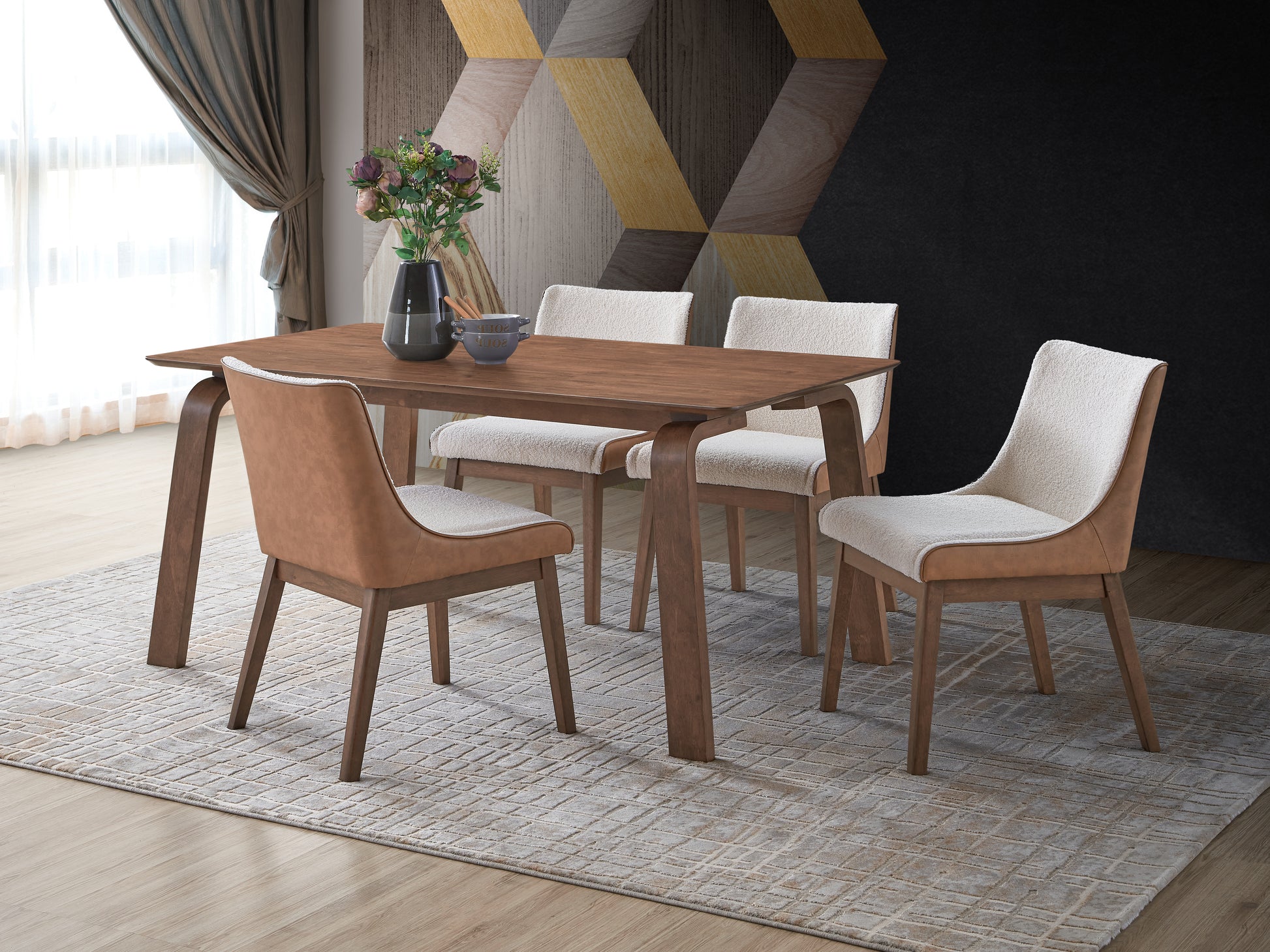 Modern dining table with curved wooden legs and four upholstered chairs