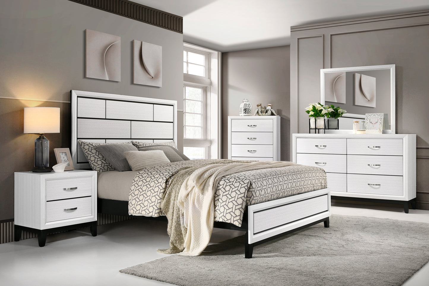 White and black panel headboard bed with geometric patterned bedding