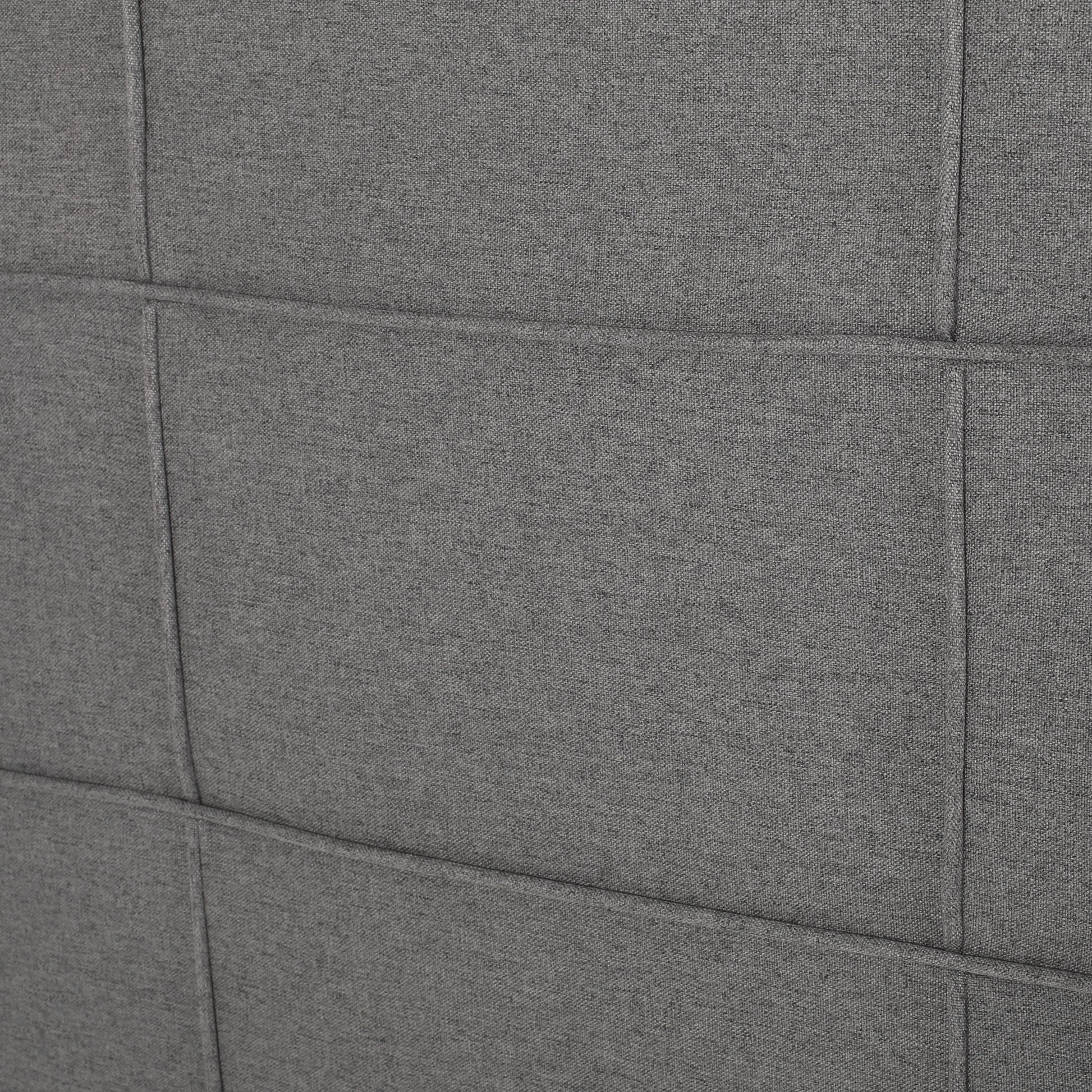 Closeup of quilted charcoal gray fabric texture