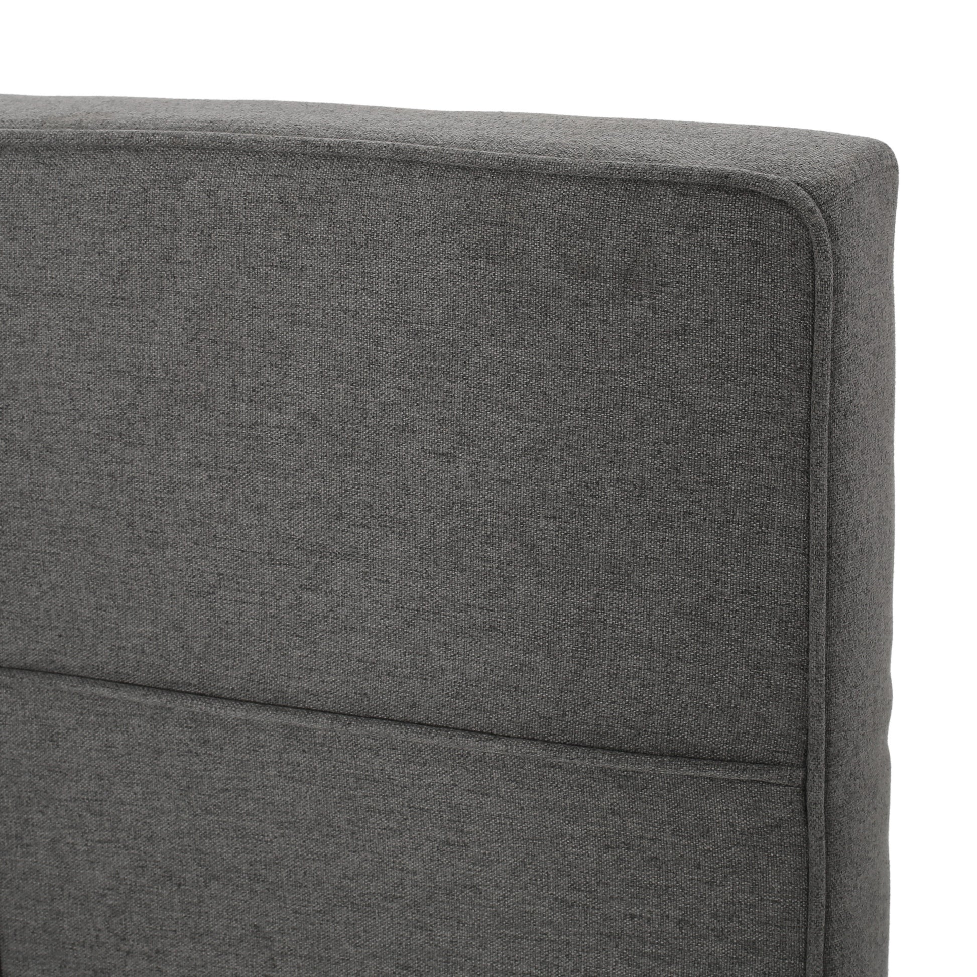 Closeup of grey woven fabric on a sofa cushion
