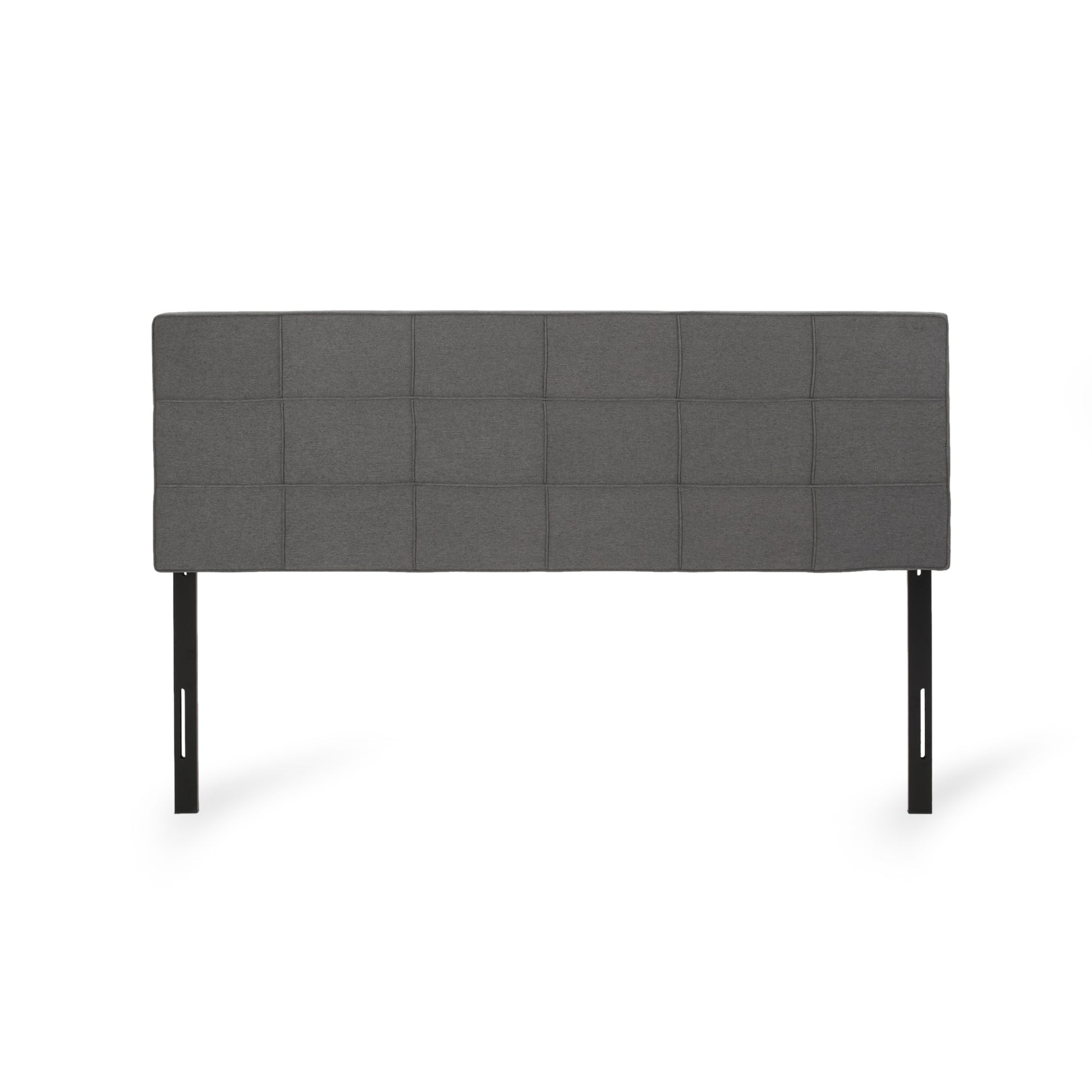 Dark grey fabric headboard with square tufting and black metal legs