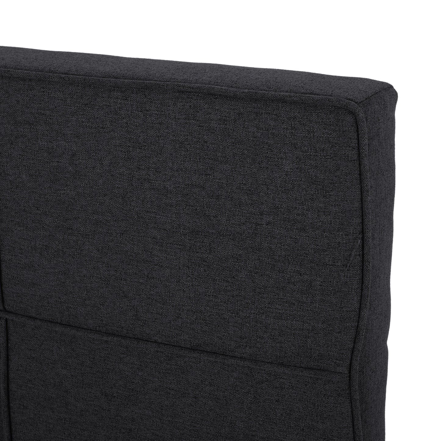 Dark charcoal fabric texture on a modern sofa cushion