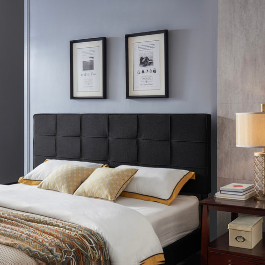 Dark gray upholstered headboard with square tufting for modern bedroom decor