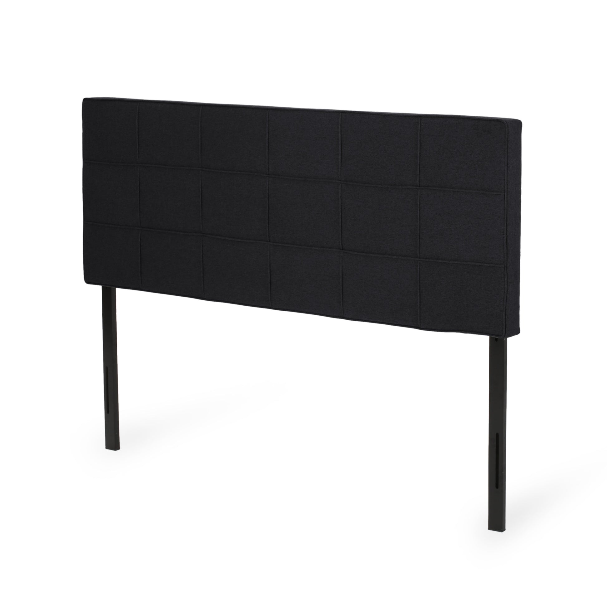Black fabric upholstered headboard with grid tufting and black metal legs