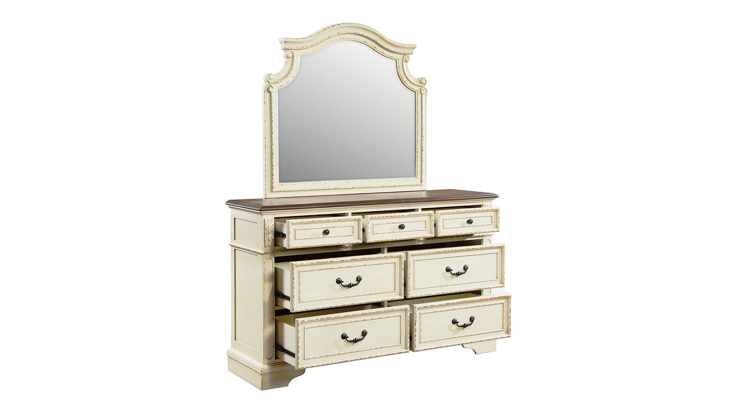 Creamy white antique dresser with ornate carved details and a large arched mirror