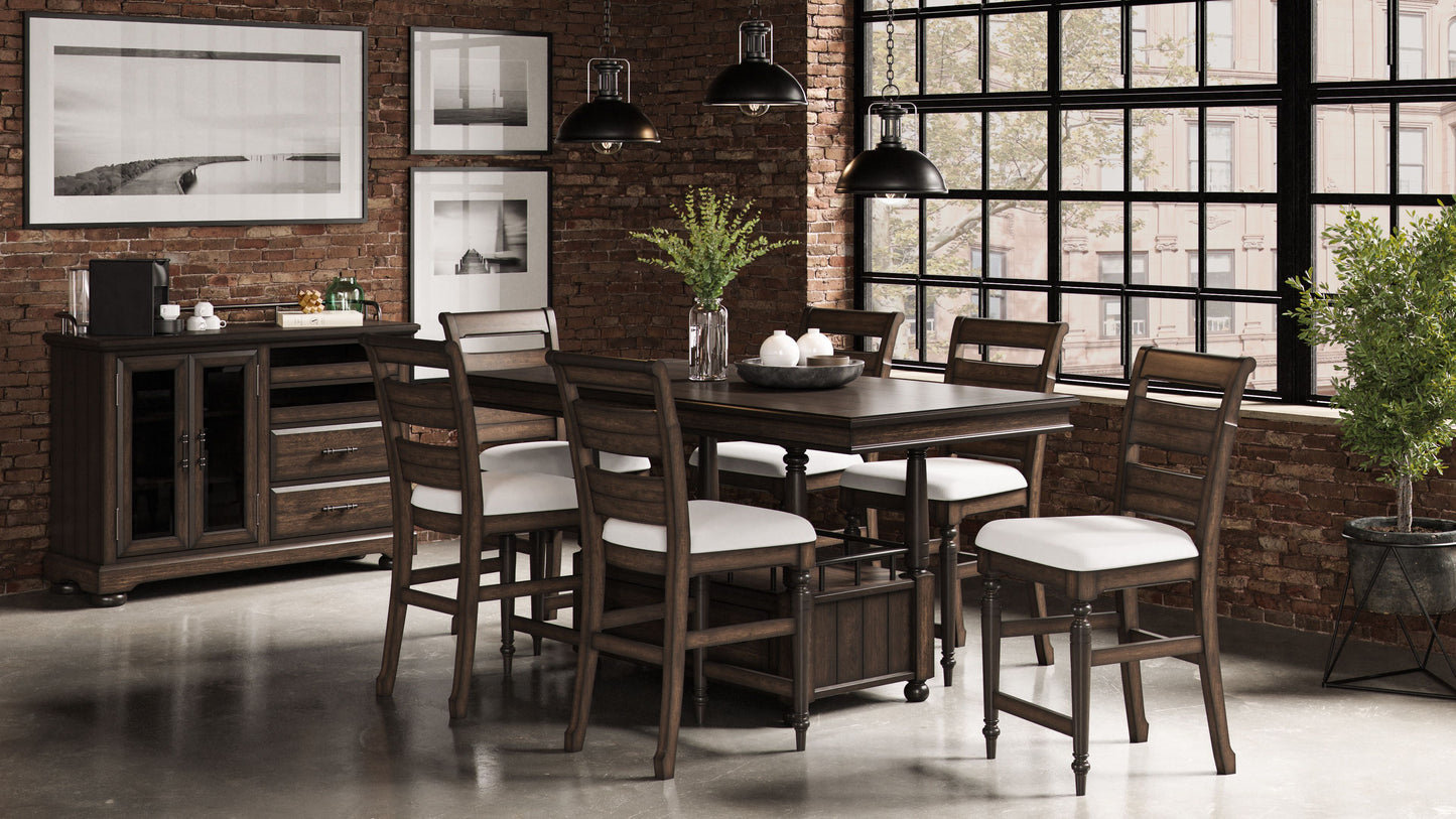Dark brown wooden dining table with white upholstered chairs and industrial pendant lights