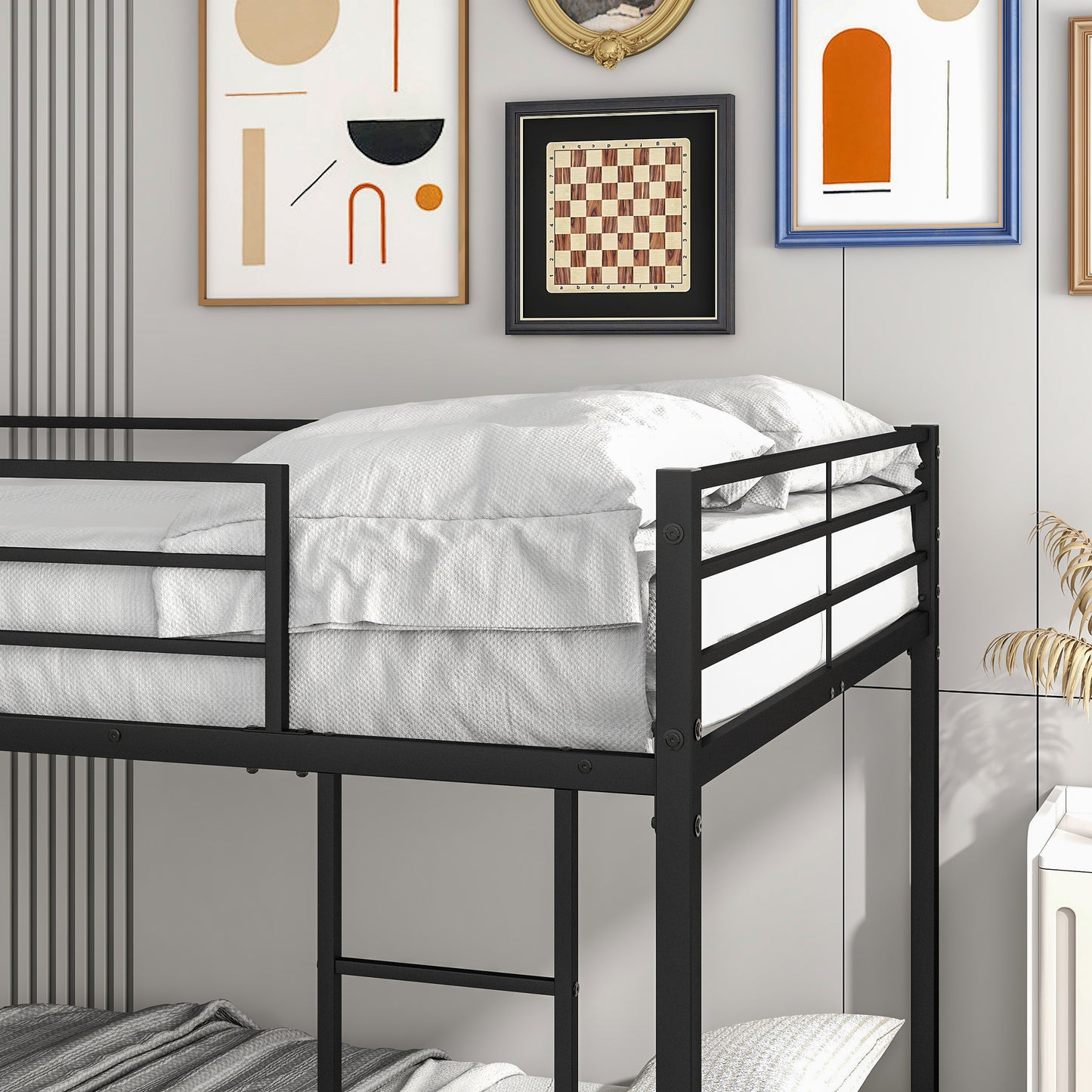 Black metal twin bunk bed with white bedding