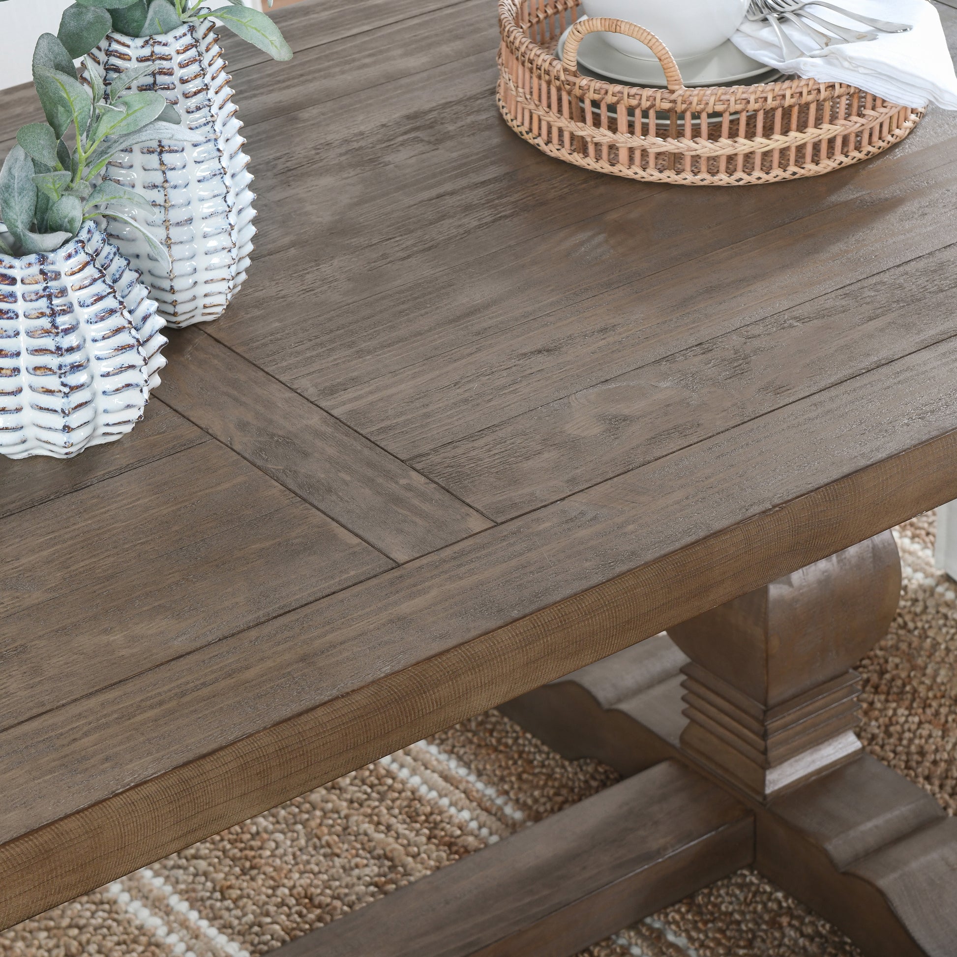 Rustic dark wood dining table with carved pedestal base