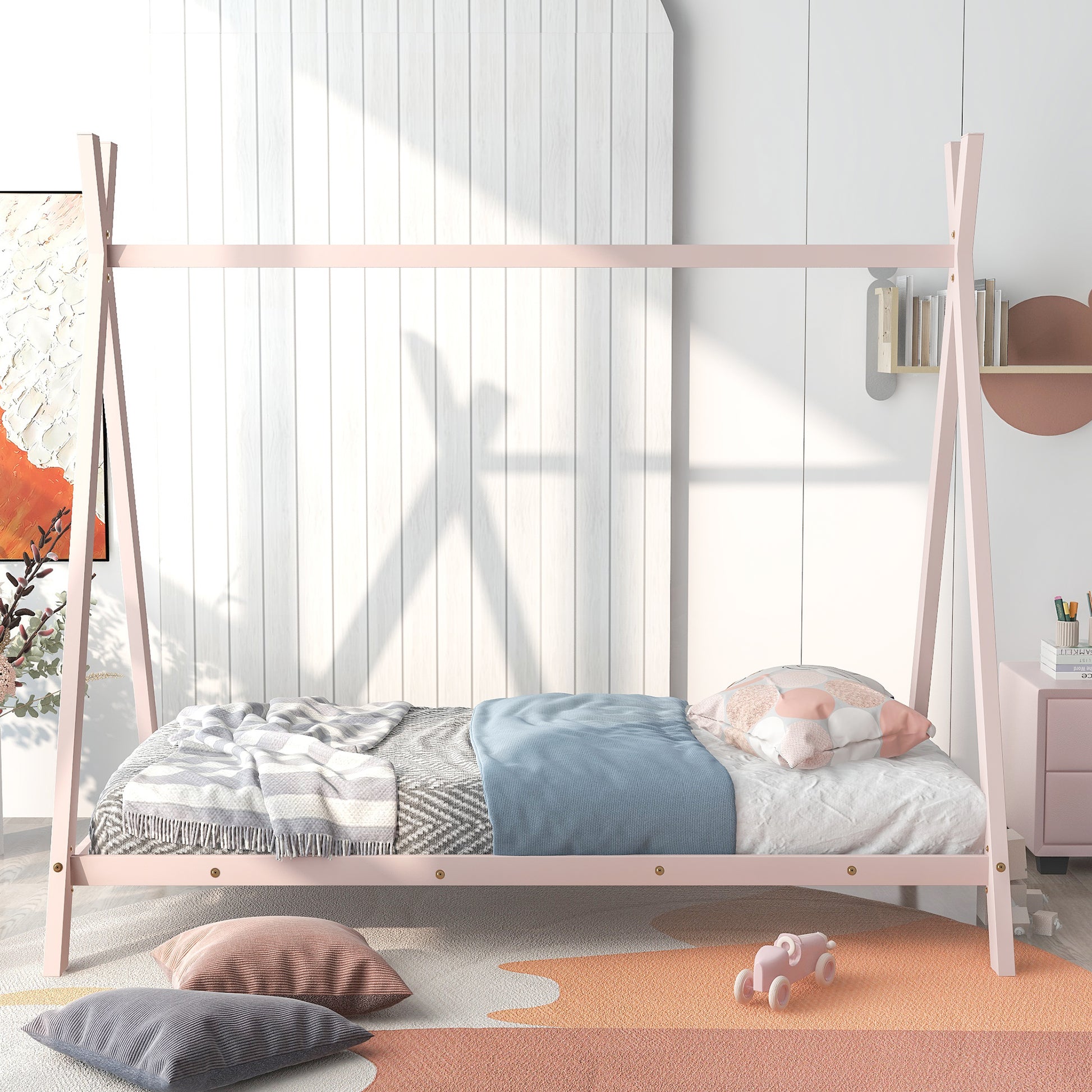 Pink Aframe toddler bed with gray and blue bedding