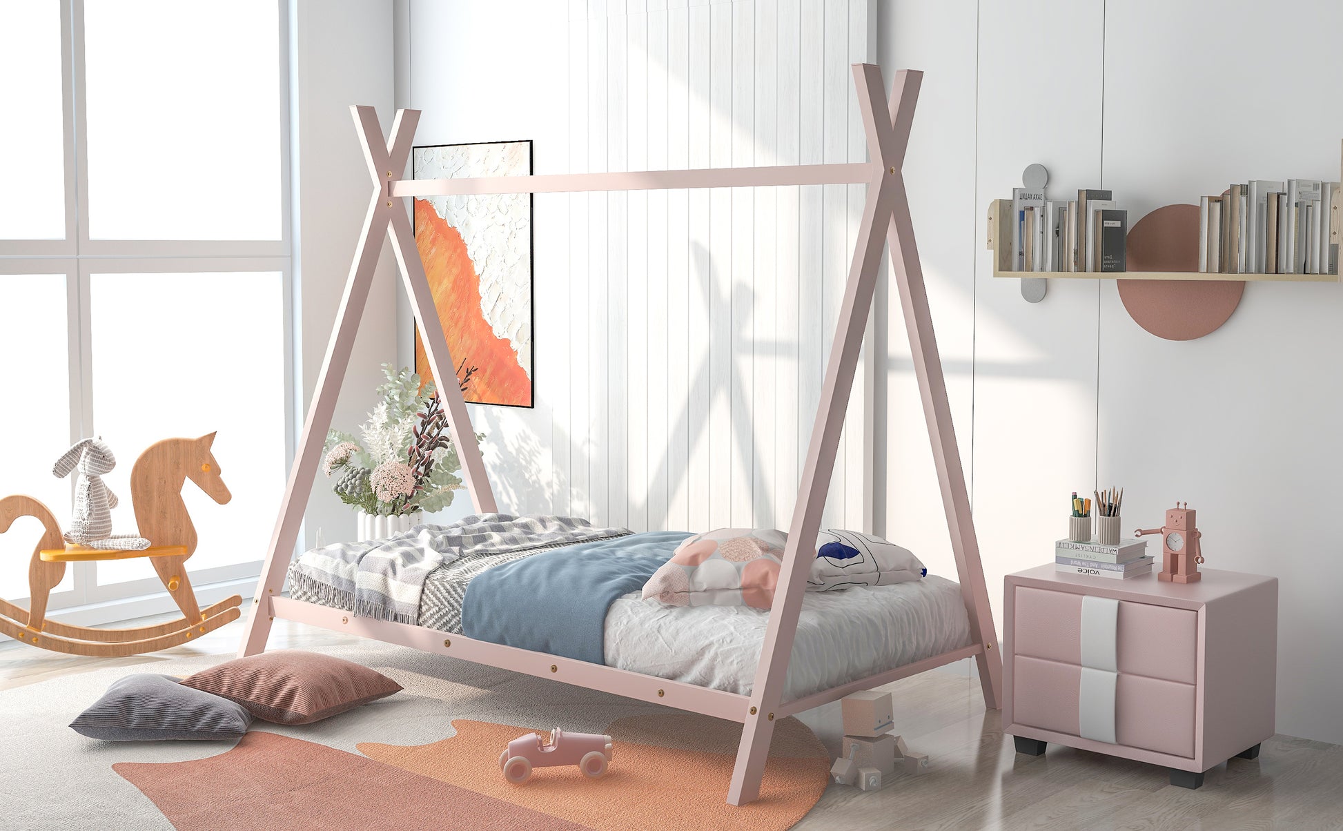 Pink wooden teepee bed with a blue blanket and decorative pillows for kids