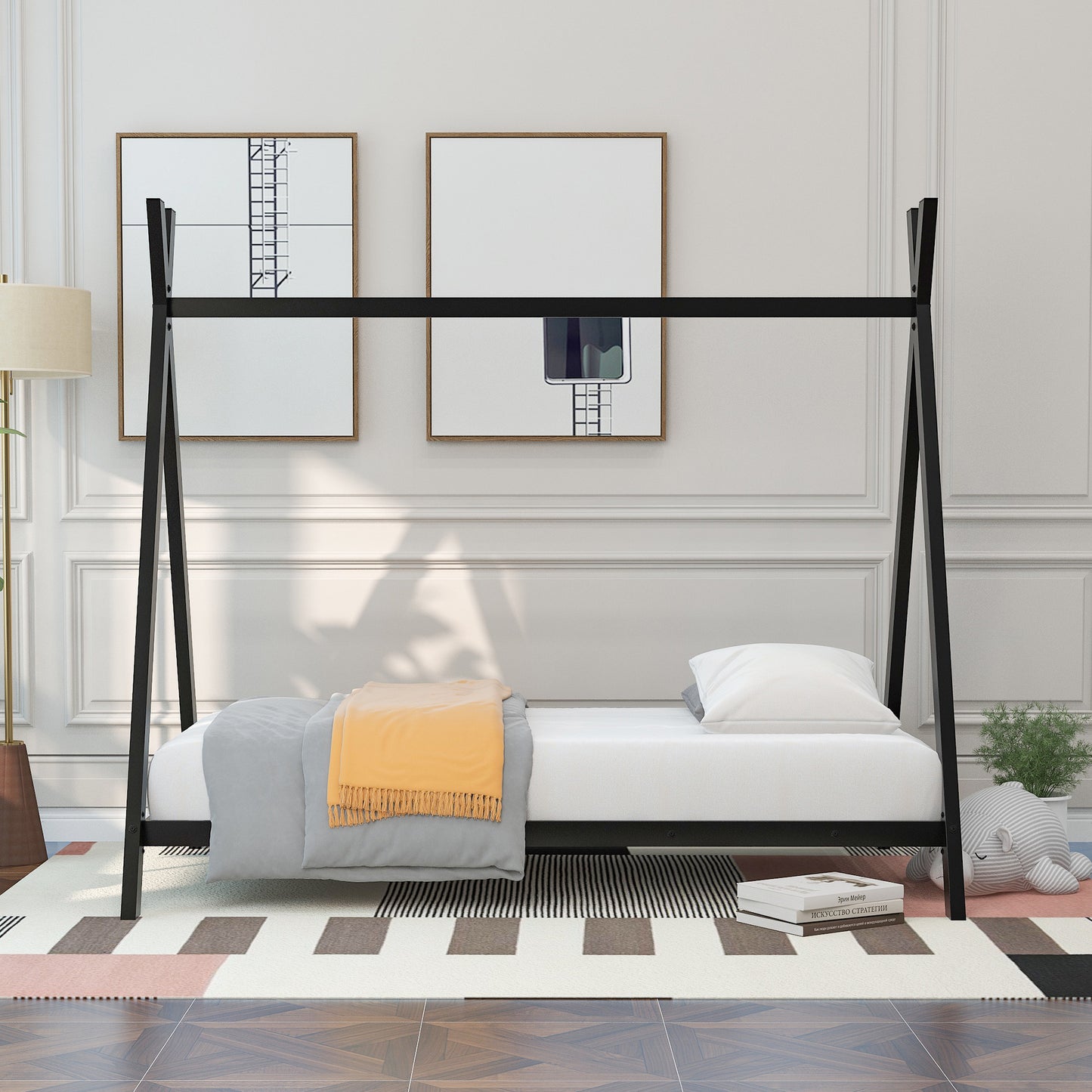 Black metal Aframe twin bed with white mattress and bedding