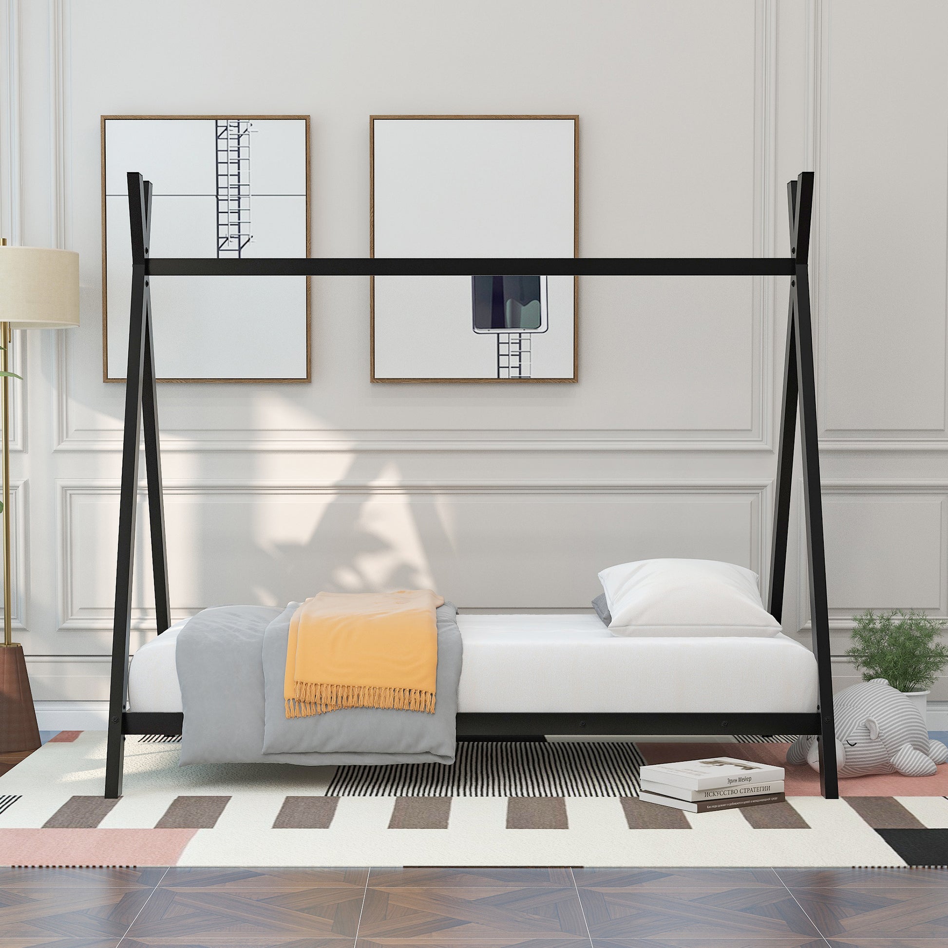 Black metal Aframe twin bed with white mattress and bedding