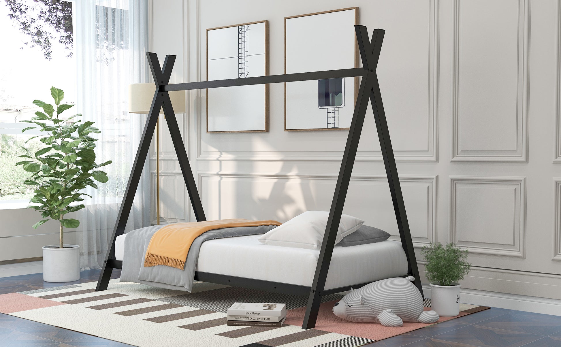 Black wooden teepee bed frame with white mattress and orange throw