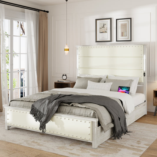 Cream upholstered king bed with silver nailhead trim and builtin LED lights