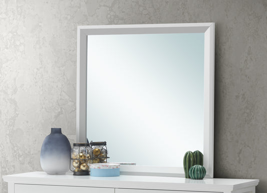 Modern white framed mirror with gradient blue vase and decorative cacti