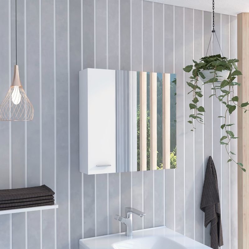 White modern medicine cabinet with mirrored doors reflecting a natural outdoor scene