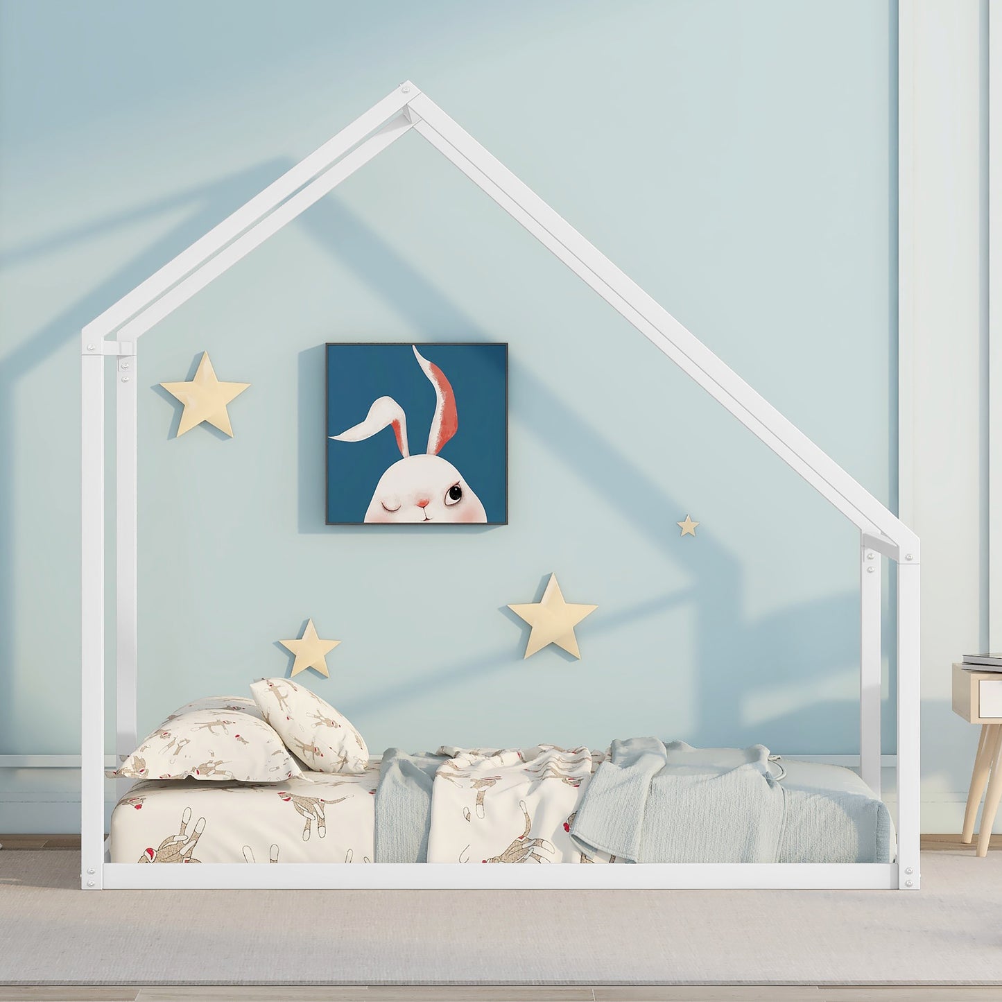 White metal house bed frame with playful bunny art and sock monkey bedding
