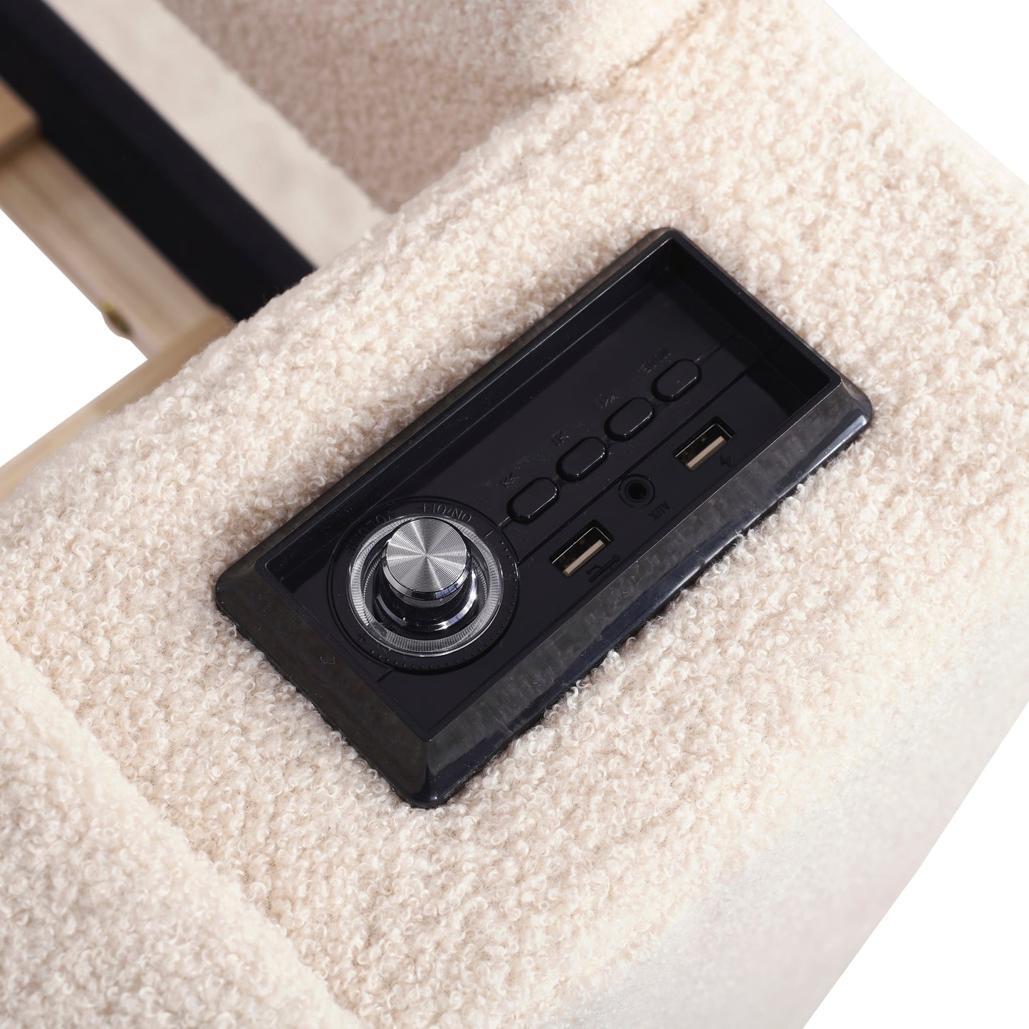Integrated speaker controls with USB ports on a cream boucle fabric chair