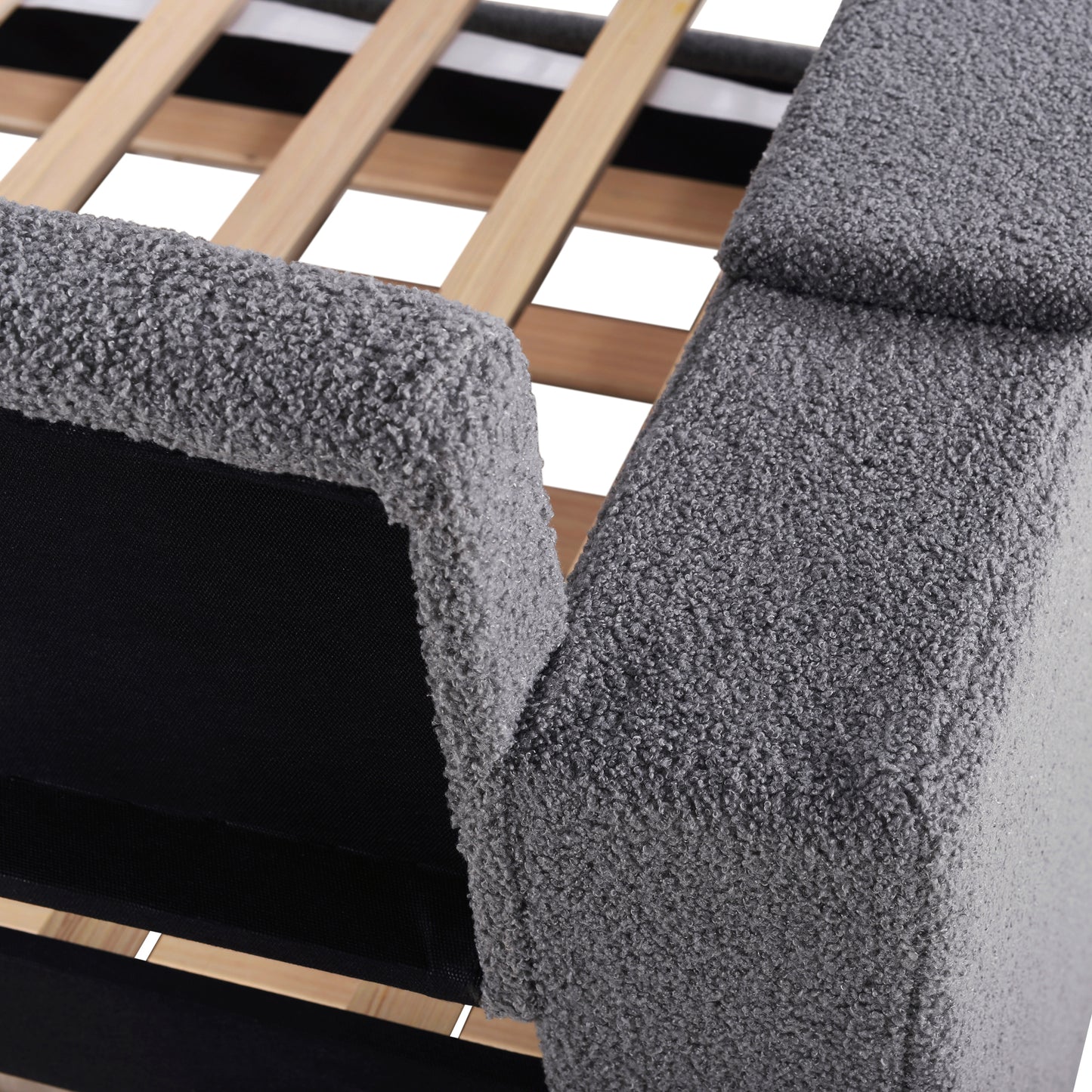 Closeup of grey teddy fabric on a bed frame with wooden slats