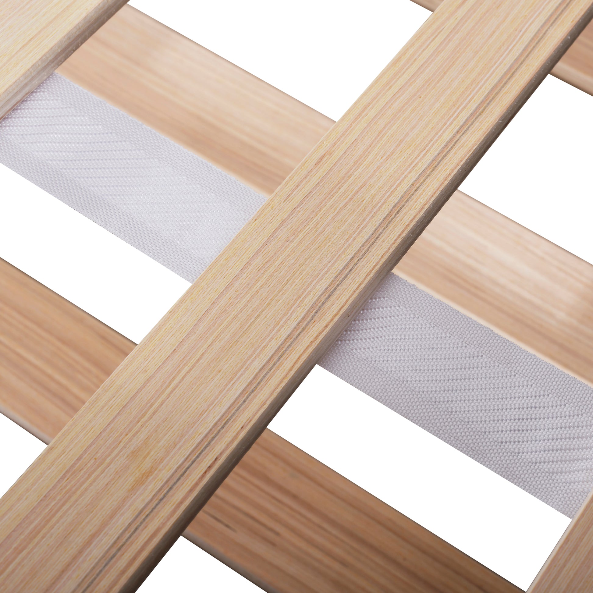 Closeup of wooden bed slats with white fabric straps for support