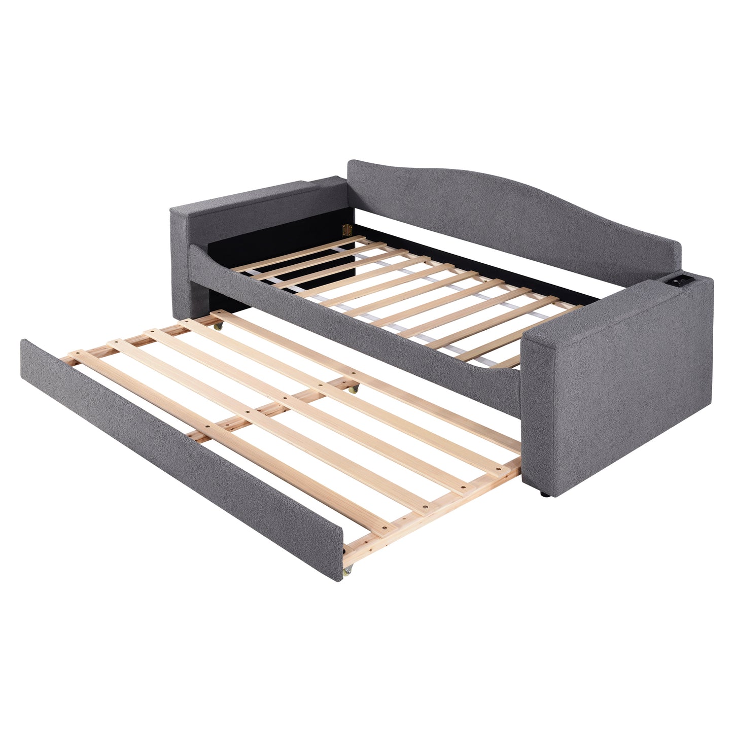 Grey upholstered sofa bed with pullout trundle frame exposed