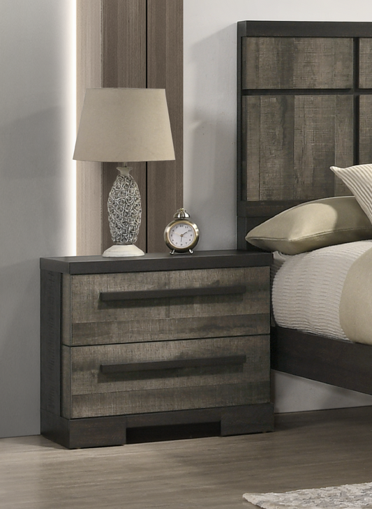 Rustic gray wood nightstand with two drawers and metal pulls A cream lampshade table lamp sits on top