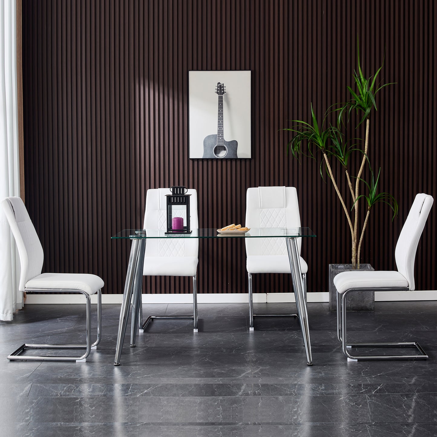Modern glass dining table with four white faux leather chairs