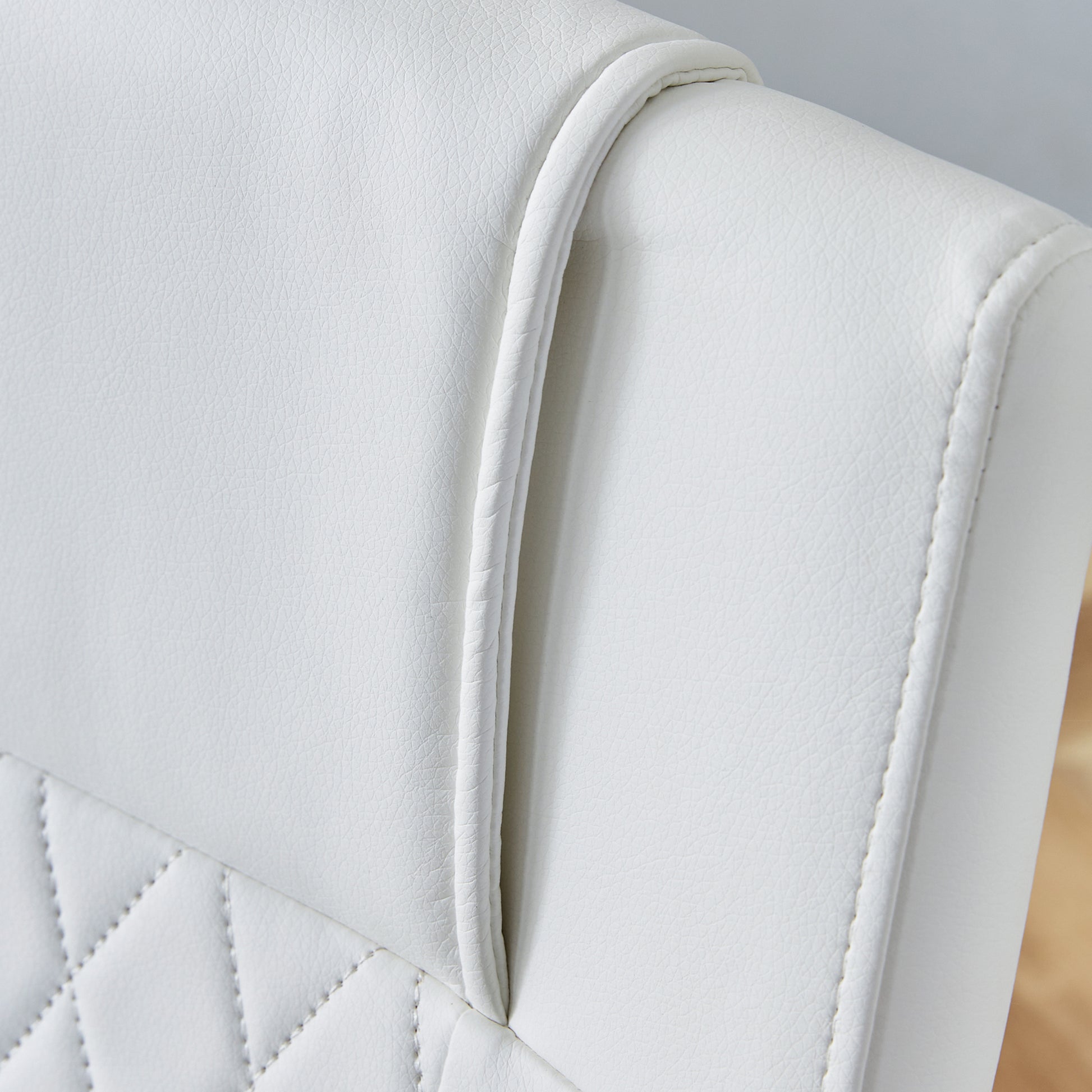 White faux leather office chair with diamond stitching detail