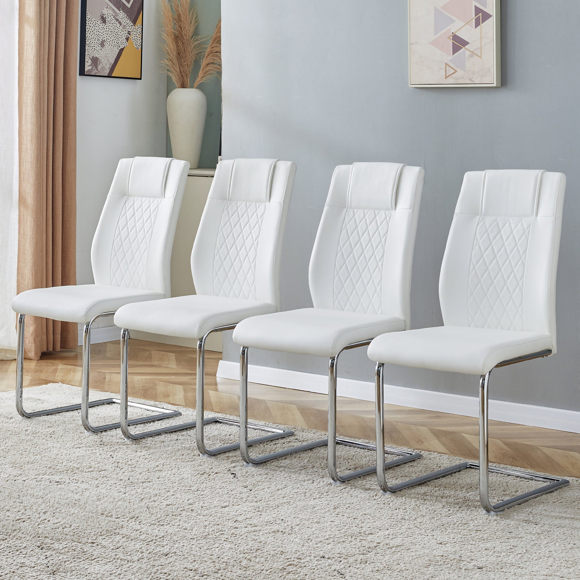 White faux leather dining chairs with diamond stitching