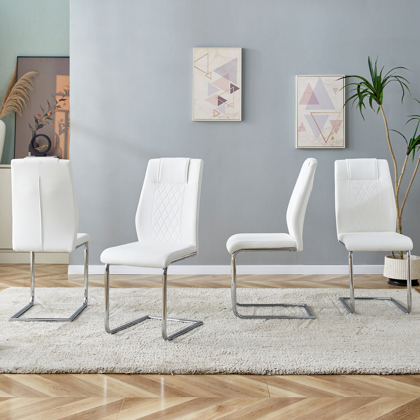 White faux leather dining chair with diamond stitching and chrome sled base