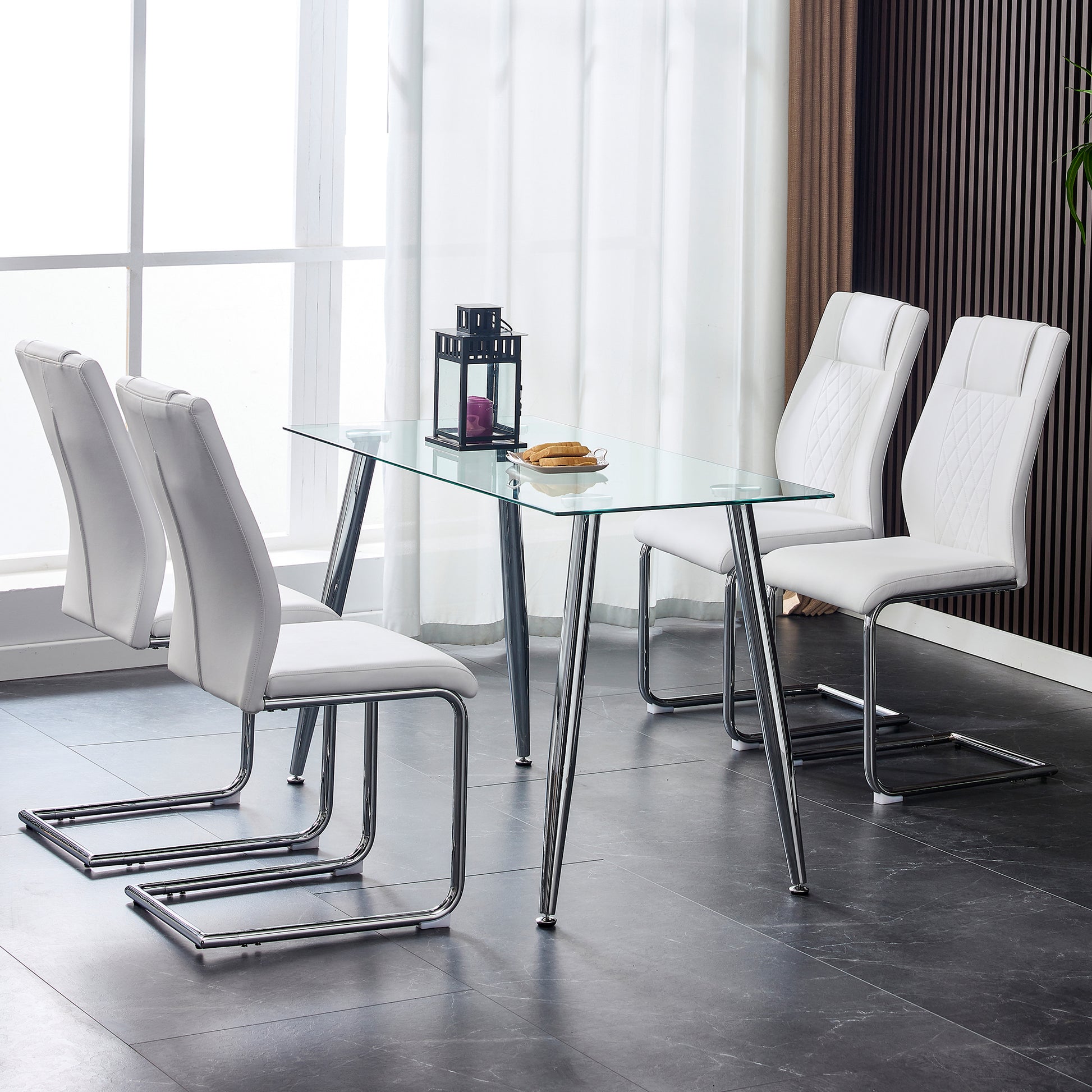 Modern white faux leather dining chairs with chrome sled legs