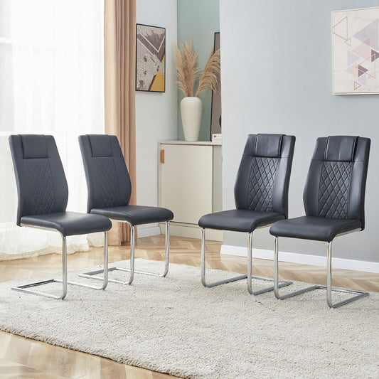 Four black faux leather dining chairs with diamond stitching and chrome sled legs