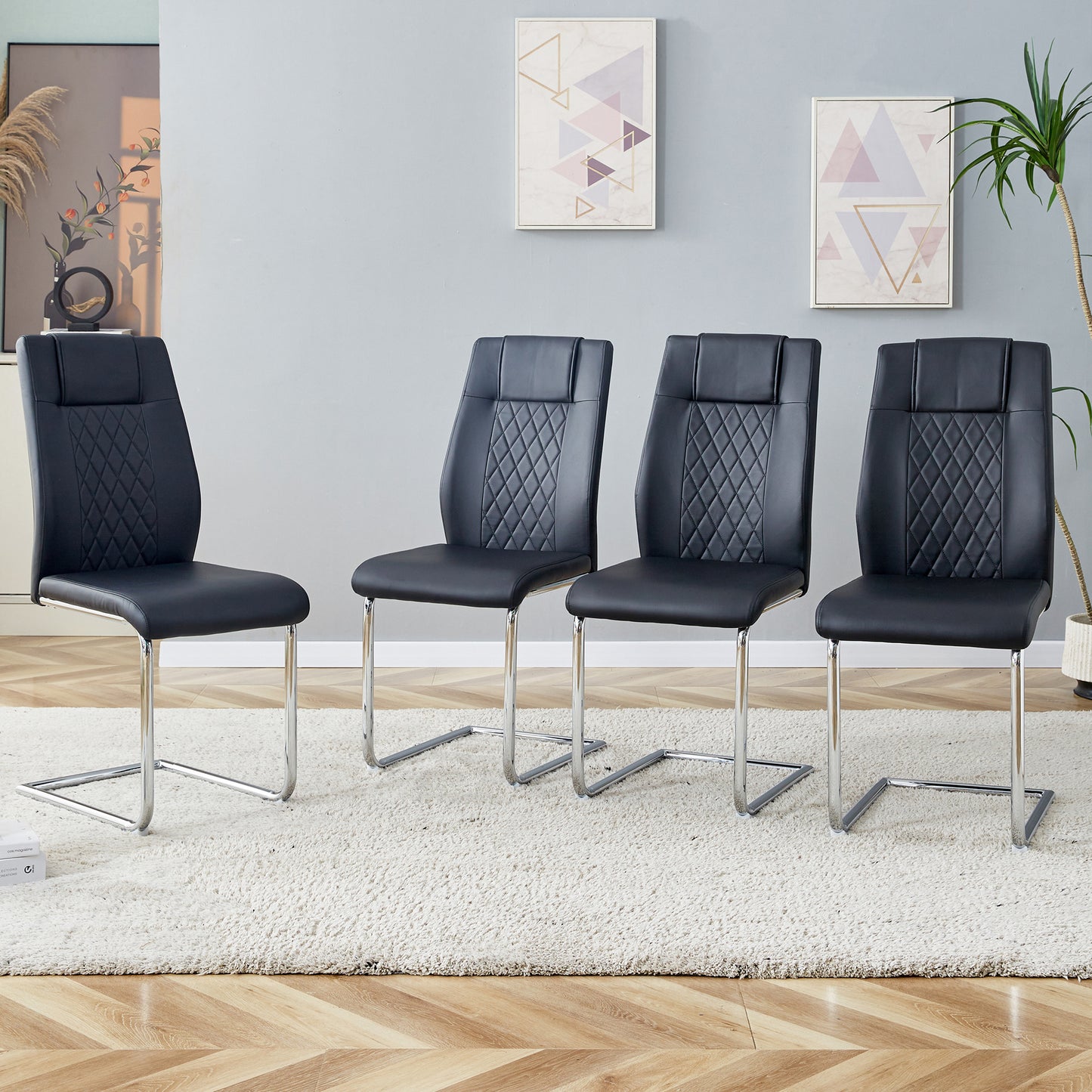 Black faux leather cantilever dining chairs with diamond stitching