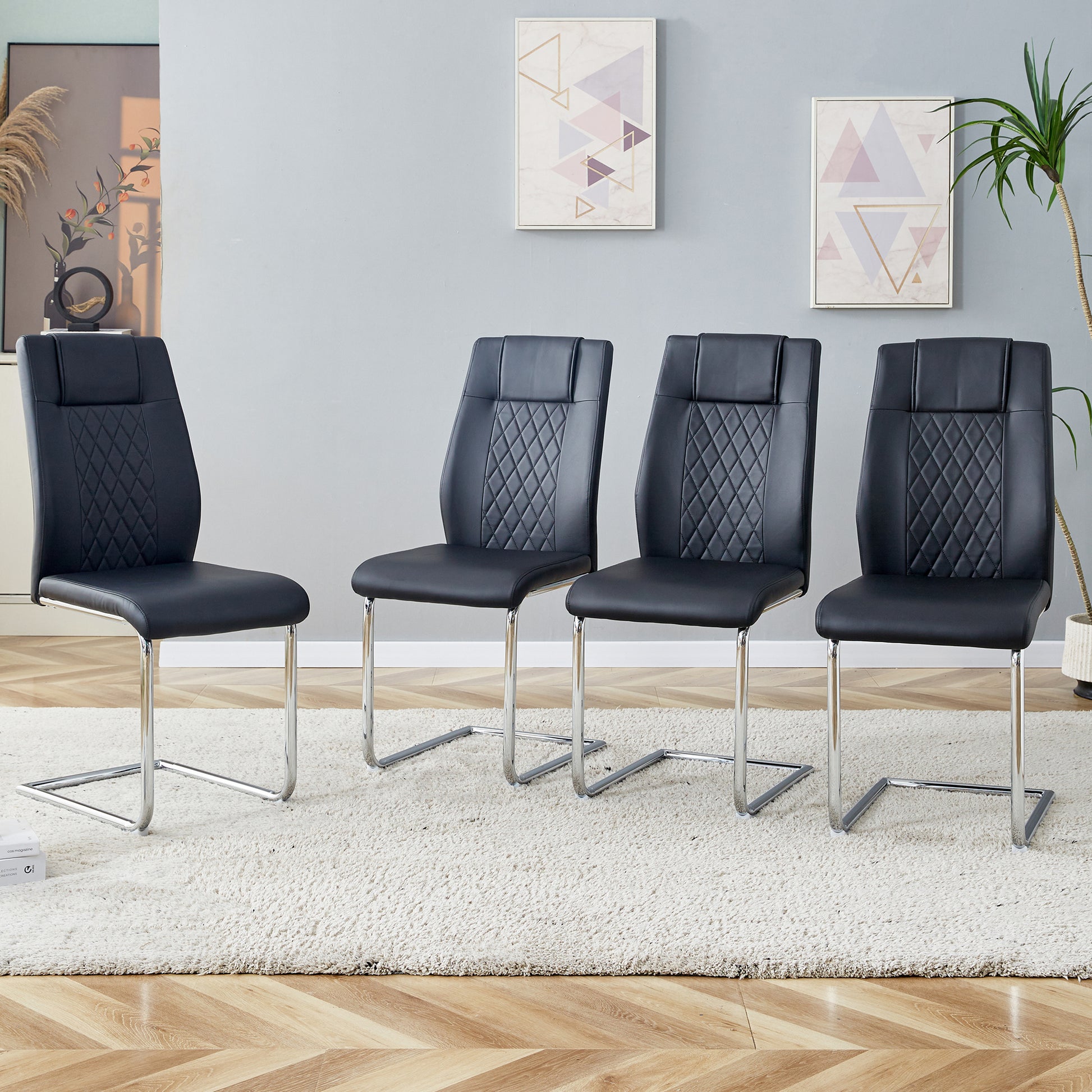 Black faux leather cantilever dining chairs with diamond stitching