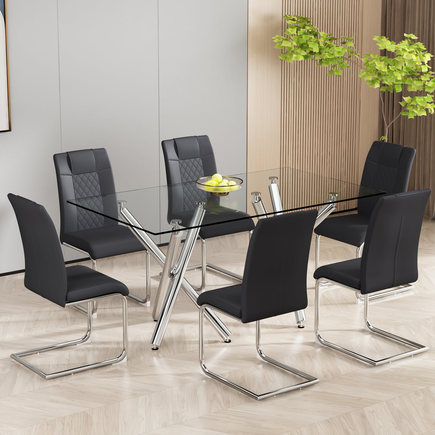 Rectangular glass dining table with chrome base and black chairs